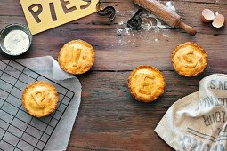 Four mini pies make up the word pies