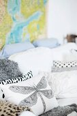 Cushions with dragonfly motif and various patterns on white couch