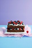 Chocolate-rum cake with cream and fresh berries
