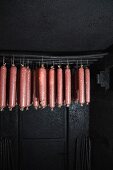 Wacholder salami, a regional speciality from Carinthia, Austria hanging in a smokehouse