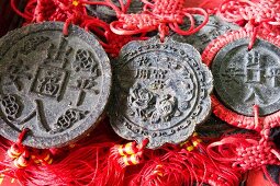 Pu-ehr tea cakes shaped like coins with Chinese writing