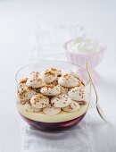 Poached peach and rosé trifle topped with meringue