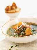 Herb fish soup with grilled bread