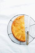 Apple and pear upside-down cake on a wire rack