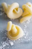 Vesuvio pasta on a floured marble surface