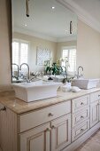 Elegant, American-style washstand with twin sinks and large mirror