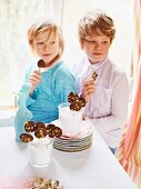 Children eating chocolate lollies at Easter