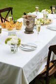 A table laid with appetisers in a garden