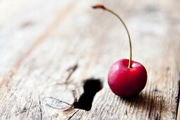 A cherry on an old wooden door