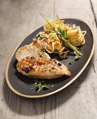 Fried chicken breast with noodle salad