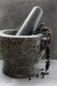Black pepper in a mortar