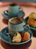 A cup of coffee with banana balls