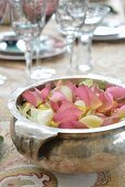Silver dish of scented petals