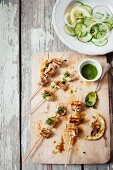 Chicken skewers with pesto and a cucumber and lemon salad
