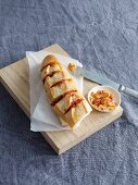 A baked baguette with tomato spread