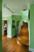 Wood floor hallway with green walls along stairs; West Palm Beach; USA