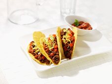 Corn tortillas filled with beef and bean salsa