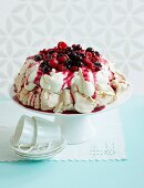 Festive pavlova with berry compote