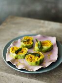 Spinach pasta rolls with a pumpkin and ricotta filling and sage butter