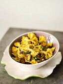 Farfalle with saffron, spring onions and courgettes