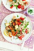 Salmon courgette skewers with prawns served with tomatoes and rice salad