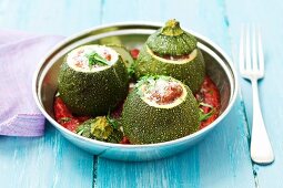 Round courgettes filled with minced meat in a tomato sauce