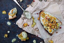 Crostino topped with basil cream and courgette flowers