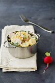 Broccoli and potato salad with radishes, onions and dill