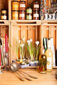 Egg box and egg shells used as planter for crocuses in kitchen shelves made from wooden crates