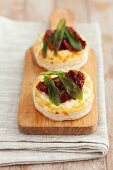 Vol-au-vents filled with feta cheese, dried tomatoes and sage