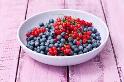 A bowl of redcurrants and blueberries