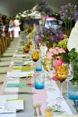 Long dining table in garden set for birthday party