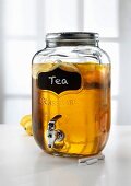 Lemon tea in a jar with a tap