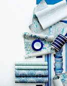 Rolls of wallpaper in different shades of blue