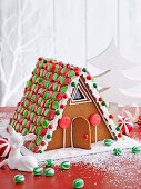 A colourfully decorated gingerbread house for Christmas
