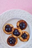 Mini pancakes with blueberries and blueberry jam