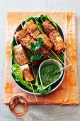 Salmon skewers with coriander pesto