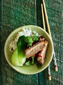 Spicy pork belly with chilli peppers, bok choy and rice (Asia)