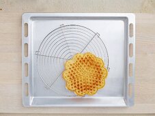 A hot waffle on a wire rack
