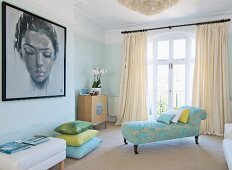 Antique, pale blue chaise longue with Baroque upholstery in front of French windows with floor-length curtains and large portrait of woman in elegant interior