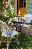 French breakfast with bistro furniture in a sunny garden