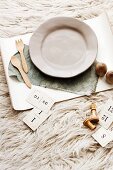 Plate with wooden cutlery on tray