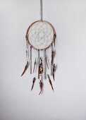 Hand-crafted dreamcatcher hanging on wall