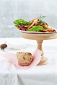A winter Christmas salad with a spelt and walnut bread roll