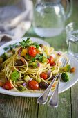 Spaghetti with vegetables, turmeric and marjoram