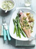 Poached trout with a caper sauce and green asparagus