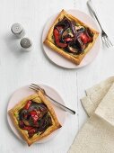 Puff pastry tarts with mushrooms, peppers and onions