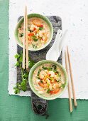 Coconut soup with red Thai curry, bok choy and spring onions