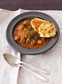 Beef goulash with corn cakes