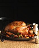 A festive roast turkey with a herb and pistachio filling and side dishes